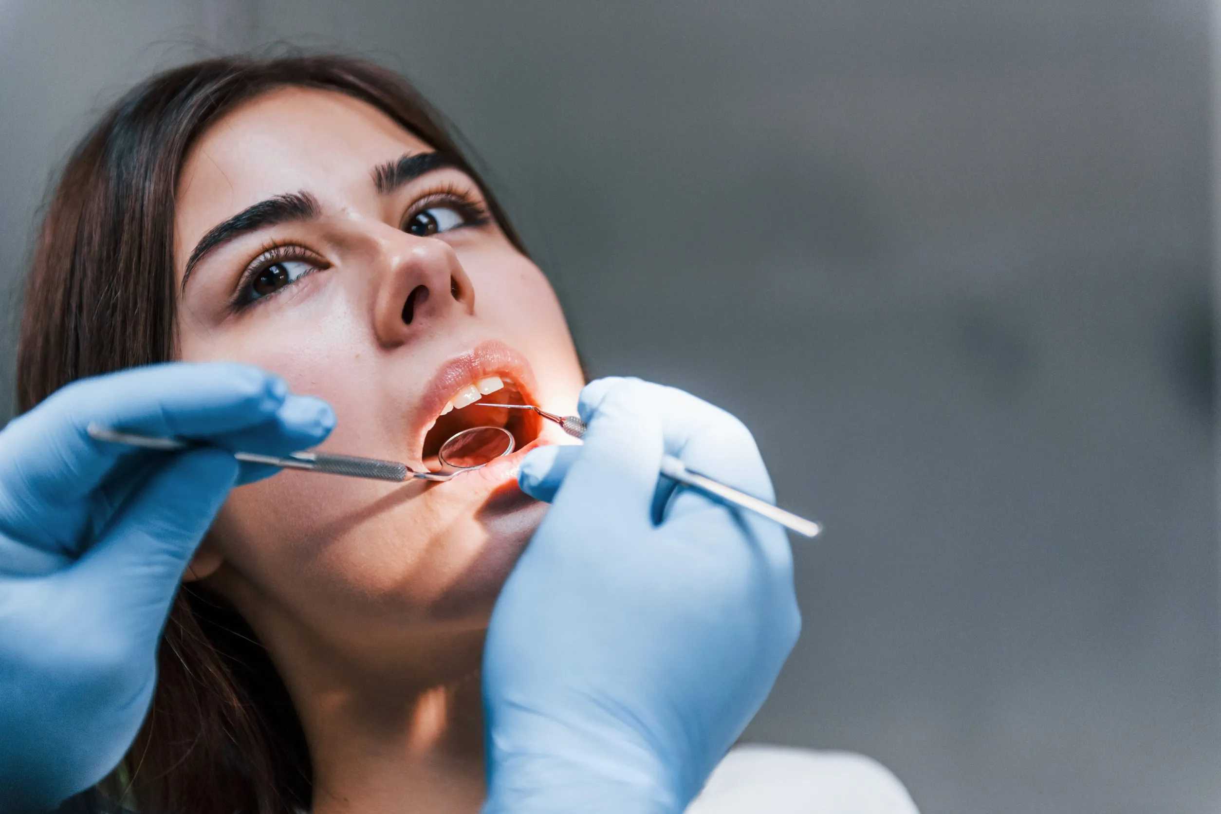 Close up view of young adult woman that have a visit in the dentist clinic